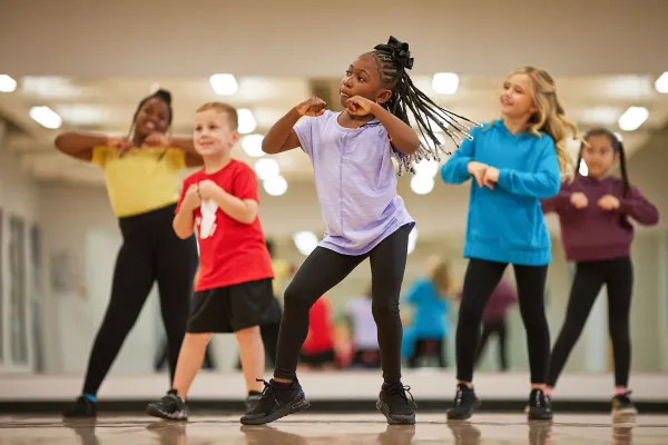 Children dancing in musical theatre workshop